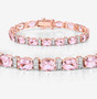 close up of morganite and diamond tennis bracelet in 14k rose gold