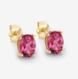 side view of oval cut pink tourmaline stud earrings in 14k yellow gold