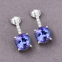 tanzanite and diamond earrings in 14k white gold shown in a lifestyle photo