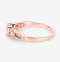 side view of morganite trilogy and diamond accent wedding ring in 14k rose gold