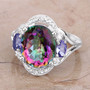 mystic quartz tanzanite and white zircon ring in rhodium over sterling silver shown in a lifestyle photo