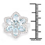 aquamarine and white zircon halo cluster ring in rhodium over sterling silver shown for size comparison