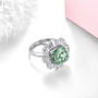 green fluorite and white zircon halo ring in rhodium over sterling silver shown in a lifestyle photo
