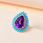 amethyst sleeping beauty turquoise and moissanite halo cluster ring in rhodium over sterling silver shown in a lifestyle photo