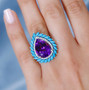 amethyst sleeping beauty turquoise and moissanite halo cluster ring in rhodium over sterling silver worn on a hand