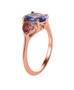 side view of tanzanite and pink tourmaline three stone ring in 18k rose gold over sterling silver