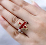 cherry fire opal and zircon ring in 18k yellow gold and rhodium over sterling silver worn on a hand