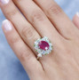 ruby opal and chrome diopside halo ring in rhodium over sterling silver worn on a hand