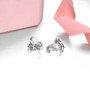 tanzanite and rhodolite garnet flower cluster earrings in rhodium over 925 sterling silver shown in a lifestyle photo
