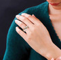 champagne and white diamond crossover bypass ring in 18k rose gold and rhodium over sterling silver worn on a hand