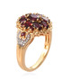 side view of garnet and white zircon ring in 18k yellow gold over sterling silver