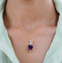 heart amethyst and moissanite pendant necklace in 18k yellow gold over sterling silver worn around the neck