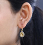 heliodor yellow sapphire and zircon dangle earrings in 18k yellow gold over sterling silver worn on the ear