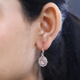 morganite pink sapphire and zircon dangle earrings in 18k rose gold over sterling silver worn on the ear