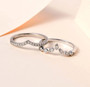 round diamond chevron stackable ring set in 18k white gold shown in a lifestyle photo