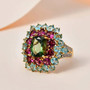 green apatite rhodolite garnet and multi gemstone statement ring in 18k yellow gold over sterling silver shown in a lifestyle photo