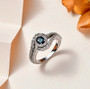 indicolite tourmaline and white zircon halo ring in rhodium over sterling silver shown in a lifestyle photo