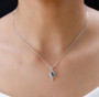 indicolite tourmaline and white zircon pendant necklace in rhodium over sterling silver worn around the neck
