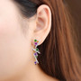 chrome diopside citrine amethyst garnet and white zircon designer earrings in rhodium over sterling silver worn on the ear