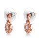 side view of morganite pink tourmaline and zircon dangle earrings in 18k rose gold over sterling silver