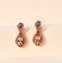 morganite pink tourmaline and zircon dangle earrings in 18k rose gold over sterling silver shown in a lifestyle photo