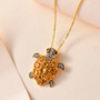 citrine chrome diopside and zircon turtle pendant necklace in 18k yellow gold over sterling silver shown in a lifestyle photo