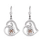 back view of garnet and moissanite heart dangle earrings in rhodium over sterling silver