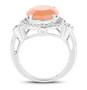 side view of peach moonstone and white topaz halo ring in rhodium over sterling silver