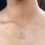 pink tourmaline tsavorite garnet and moissanite halo pendant necklace in 18k rose gold over sterling silver worn around the neck