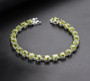 round peridot tennis bracelet in rhodium over sterling silver
