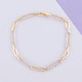 diamond paper clip bracelet in 10k yellow gold shown in a lifestyle photo