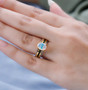 ethiopian opal chrome diopside and white zircon bridge ring in 18k yellow gold over sterling silver worn on a hand