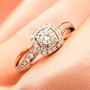 diamond engagement ring in 14k rose and white gold shown in a lifestyle photo