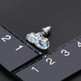 close up of sky blue topaz and white zircon stud earrings in rhodium over sterling silver