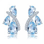 sky blue topaz and white zircon stud earrings in rhodium over sterling silver
