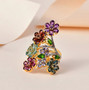 multi gemstone flower cluster ring in 18k yellow gold over sterling silver shown in a lifestyle photo