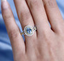 aquamarine yellow and white diamond halo ring in 10k white gold on hand model