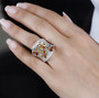 multi color sapphire and white zircon wide band ring in rhodium over sterling silver worn on a hand