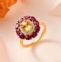 heliodor rhodolite garnet and moissanite halo ring in 18k rose gold over sterling silver shown in a lifestyle photo