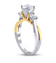 side view of diamond three stone wedding ring in 14k yellow and white gold