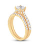 side view of princess and round diamond two ring wedding set in 14k yellow gold