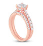 side view of princess and round diamond two ring wedding set in 14k yellow gold