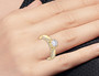round solitaire diamond wedding ring in 14k yellow gold worn on a hand