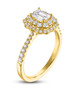 side view of emerald and round diamond double halo wedding ring in 14k yellow gold