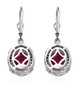 back view of ruby (ff) and black spinel halo lever back earrings in black and white rhodium over sterling silver