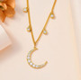 moissanite moon station necklace in 18k yellow gold over sterling silver shown in a lifestyle photo