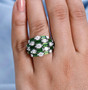 chrome diopside and moissanite dome cluster ring wide band ring in rhodium over sterling silver worn on a hand