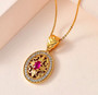ruby and white zircon pendant necklace in 18k yellow gold over sterling silver worn around the neck