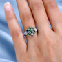 green apatite and white zircon cluster ring in rhodium over sterling silver worn on a hand