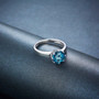 full view of london blue topaz solitaire ring in rhodium over sterling silver